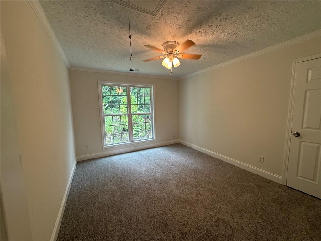 2966 Fairton Trail Lithonia, GA 30038 - Photo 21 of 28 an empty room with a window and a fan