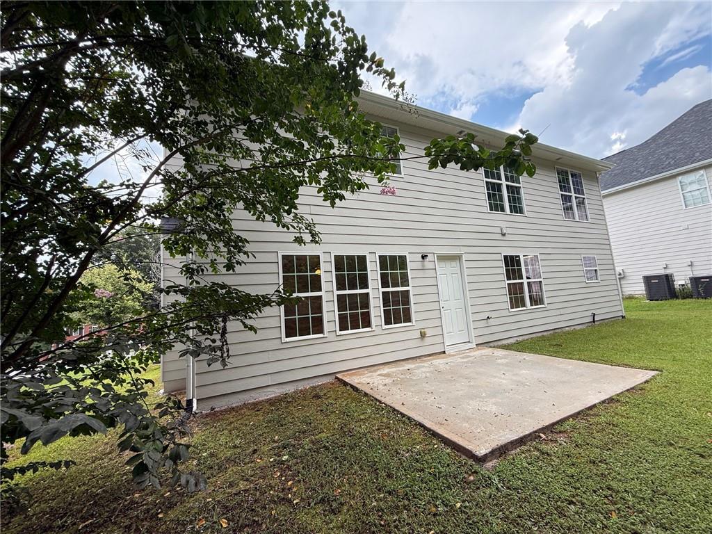 2966 Fairton Trail Lithonia, GA 30038 - Photo 24 of 28 a front view of a house with a garden