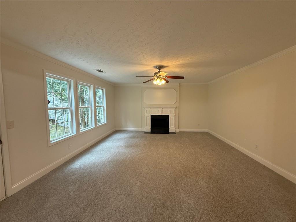 2966 Fairton Trail Lithonia, GA 30038 - Photo 9 of 28 a view of a livingroom with a ceiling fan and window