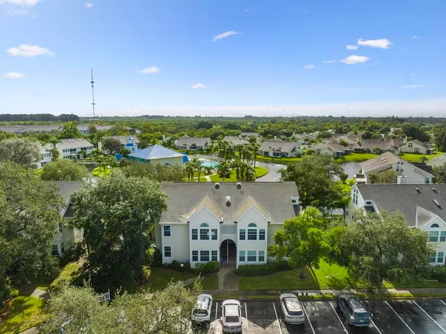 an aerial view of a house with a garden