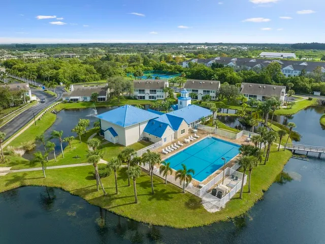 an aerial view of a house with a swimming pool