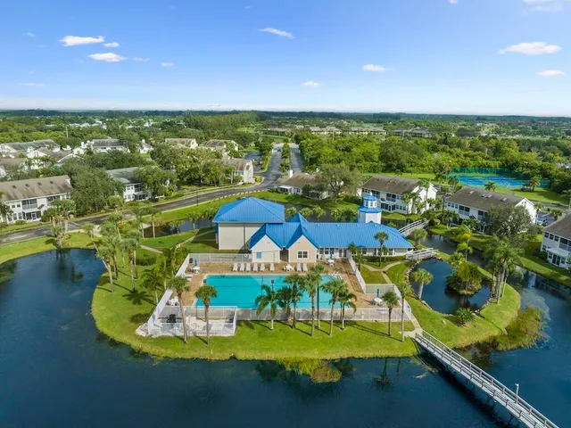 a view of a swimming pool with a yard
