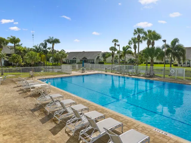 a view of a swimming pool and an outdoor space