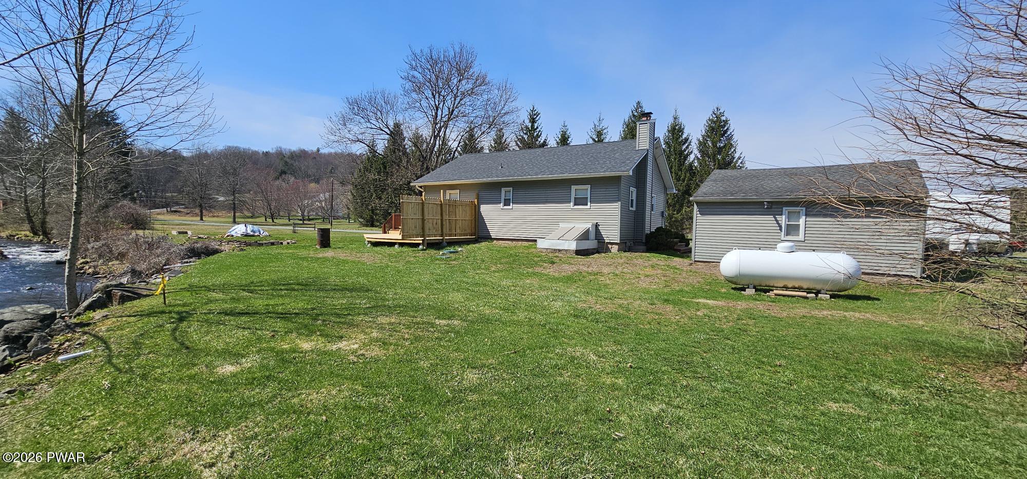 430 Griffith Road Tyler Hill, PA 18469 - Photo 31 of 31 a view of a backyard with a garden and plants