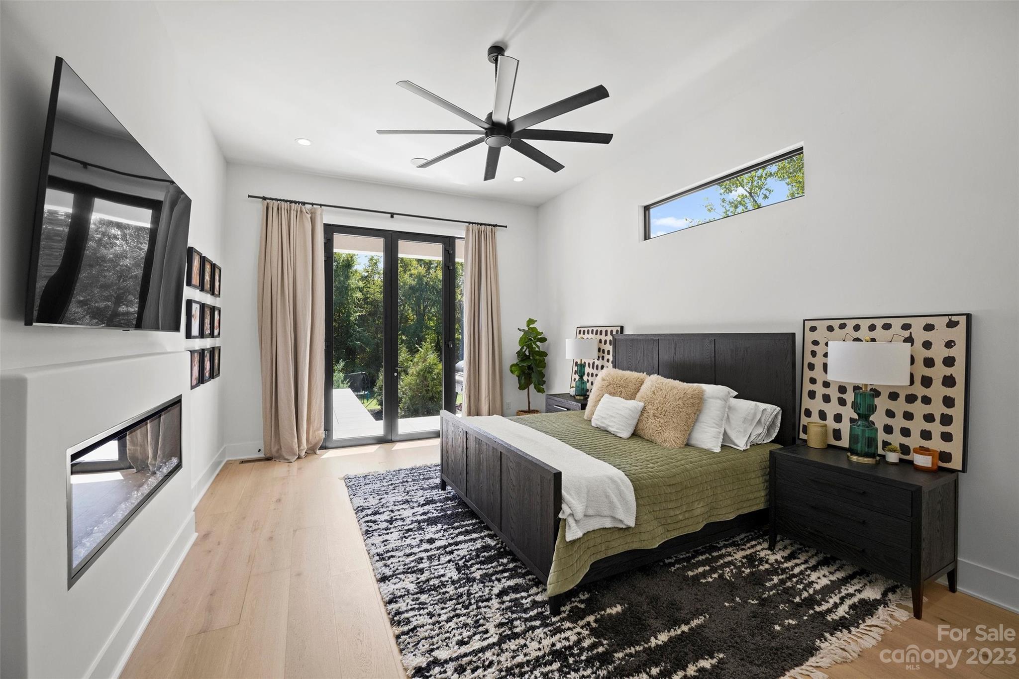 20108 Schooner Drive Cornelius, NC 28031 - Photo 17 of 46 a bedroom with a bed painting on wall and a large window
