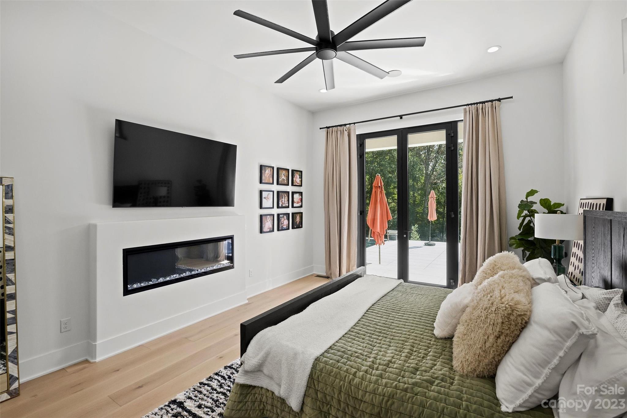 20108 Schooner Drive Cornelius, NC 28031 - Photo 18 of 46 a bedroom with a bed and a flat screen tv