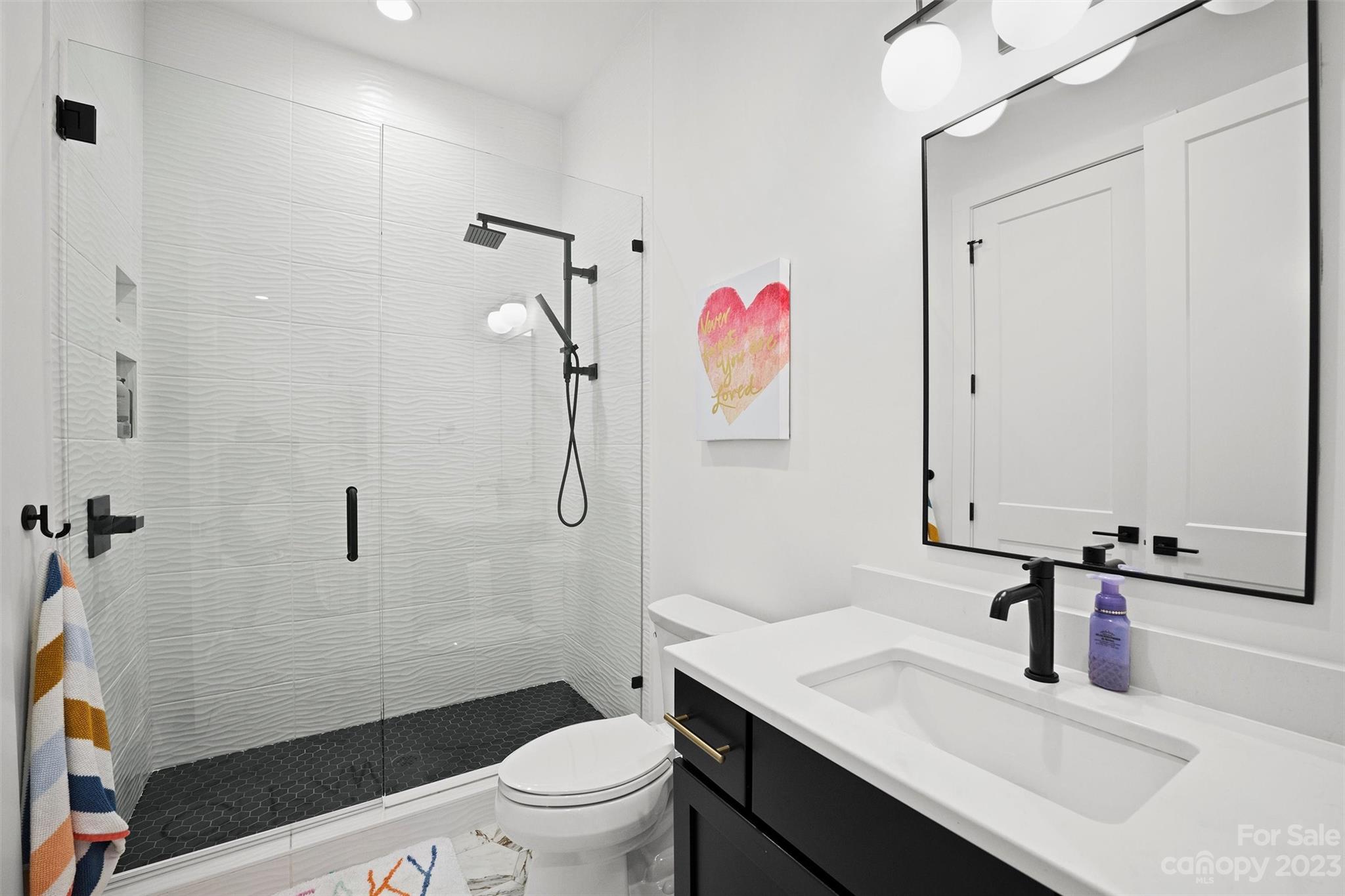 20108 Schooner Drive Cornelius, NC 28031 - Photo 23 of 46 a bathroom with a sink toilet and shower