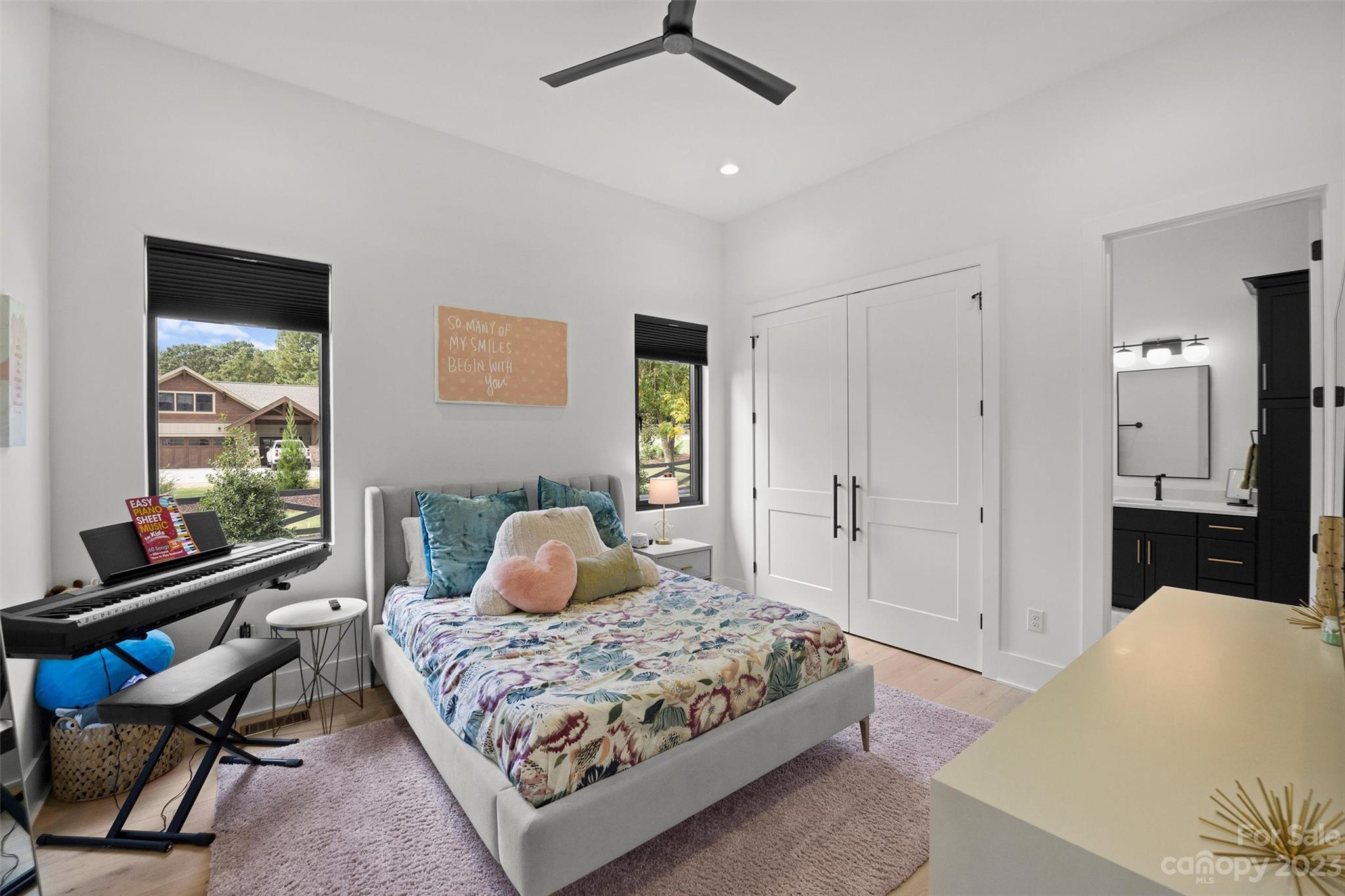 20108 Schooner Drive Cornelius, NC 28031 - Photo 24 of 46 a bedroom with a bed and wooden floor