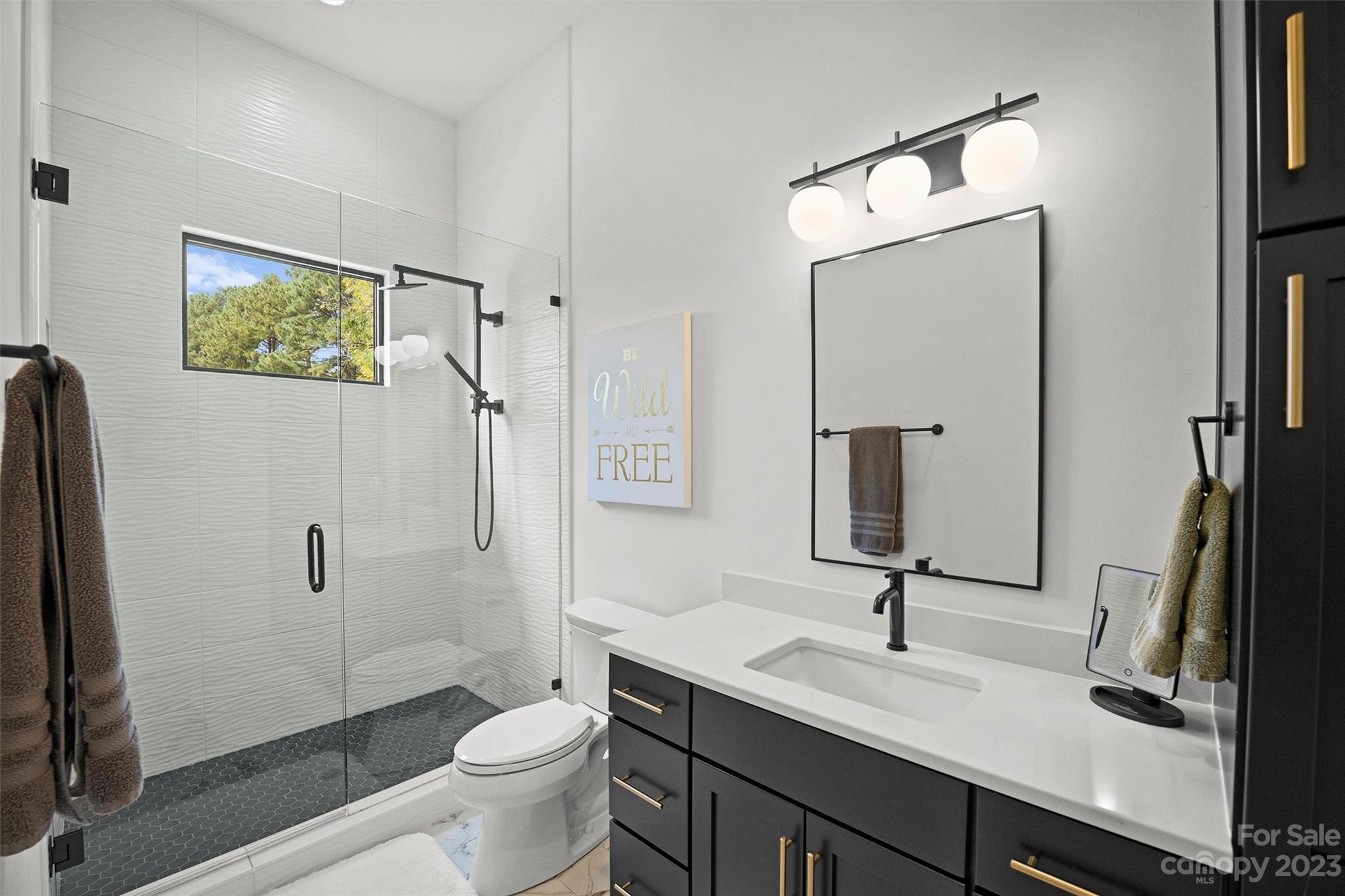 20108 Schooner Drive Cornelius, NC 28031 - Photo 25 of 46 a bathroom with a toilet sink and mirror