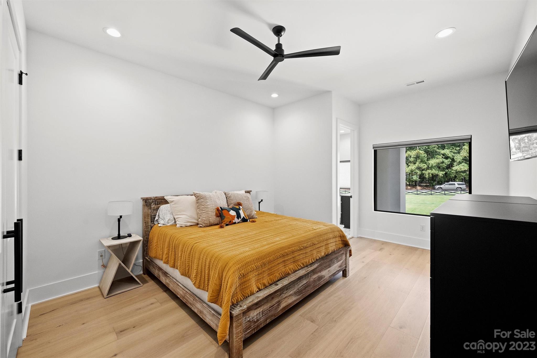 20108 Schooner Drive Cornelius, NC 28031 - Photo 27 of 46 a bedroom with a bed and a dresser