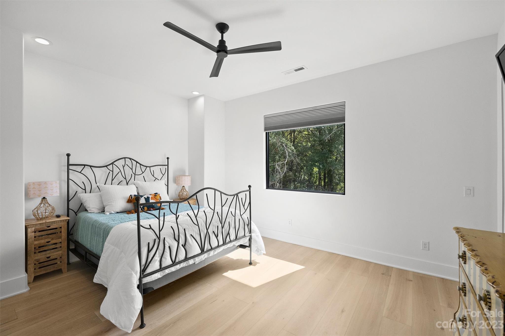 20108 Schooner Drive Cornelius, NC 28031 - Photo 30 of 46 a bedroom with a bed and a window