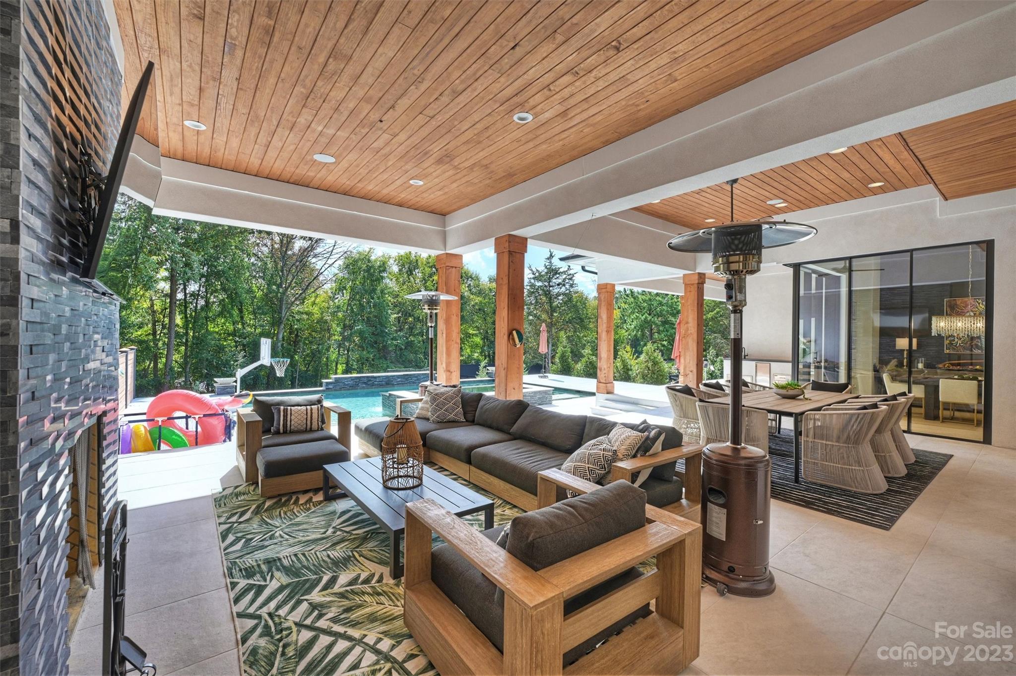 20108 Schooner Drive Cornelius, NC 28031 - Photo 36 of 46 a living room with patio furniture and a floor to ceiling window