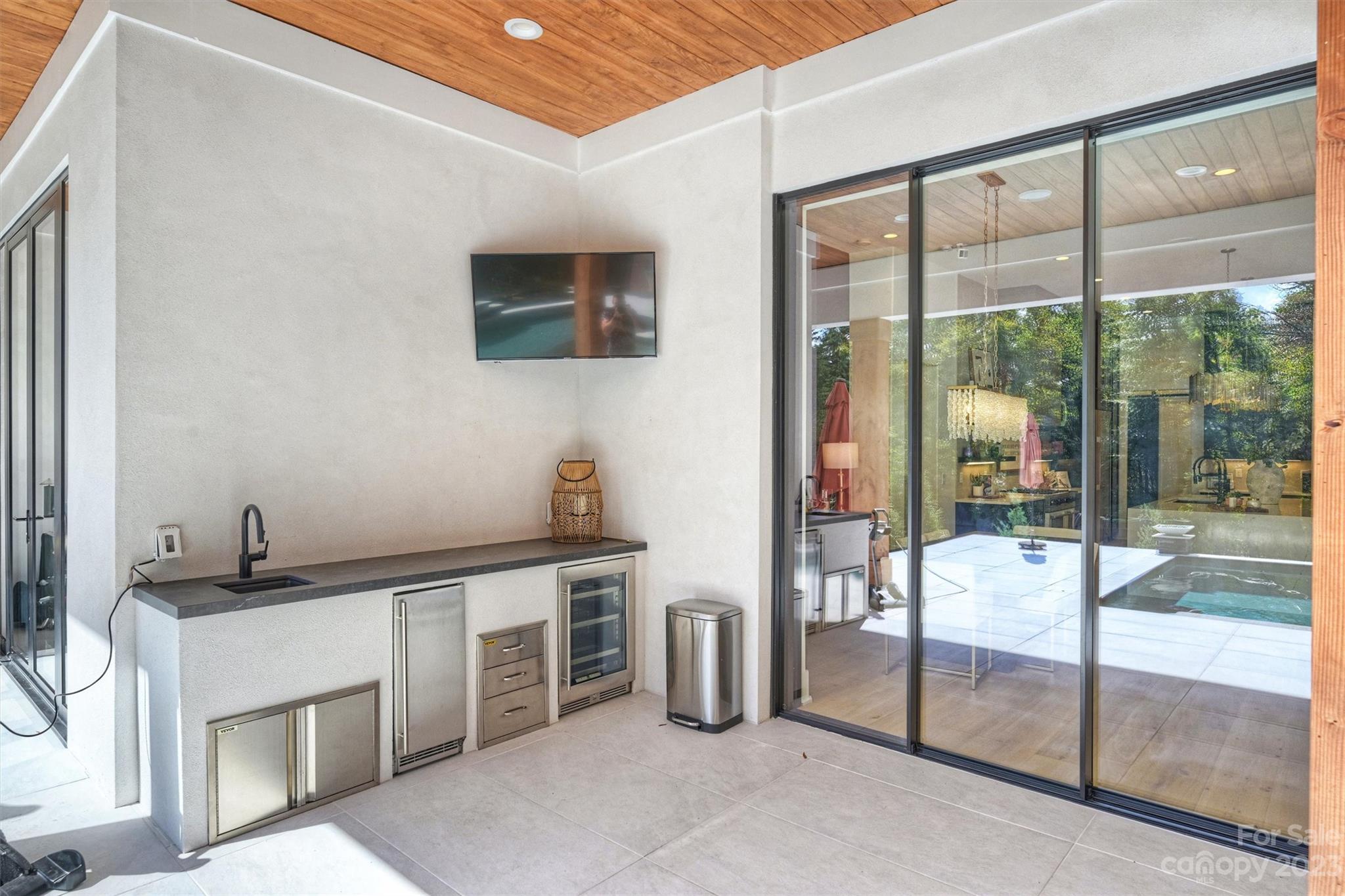 20108 Schooner Drive Cornelius, NC 28031 - Photo 38 of 46 a kitchen with white cabinets and outdoor space