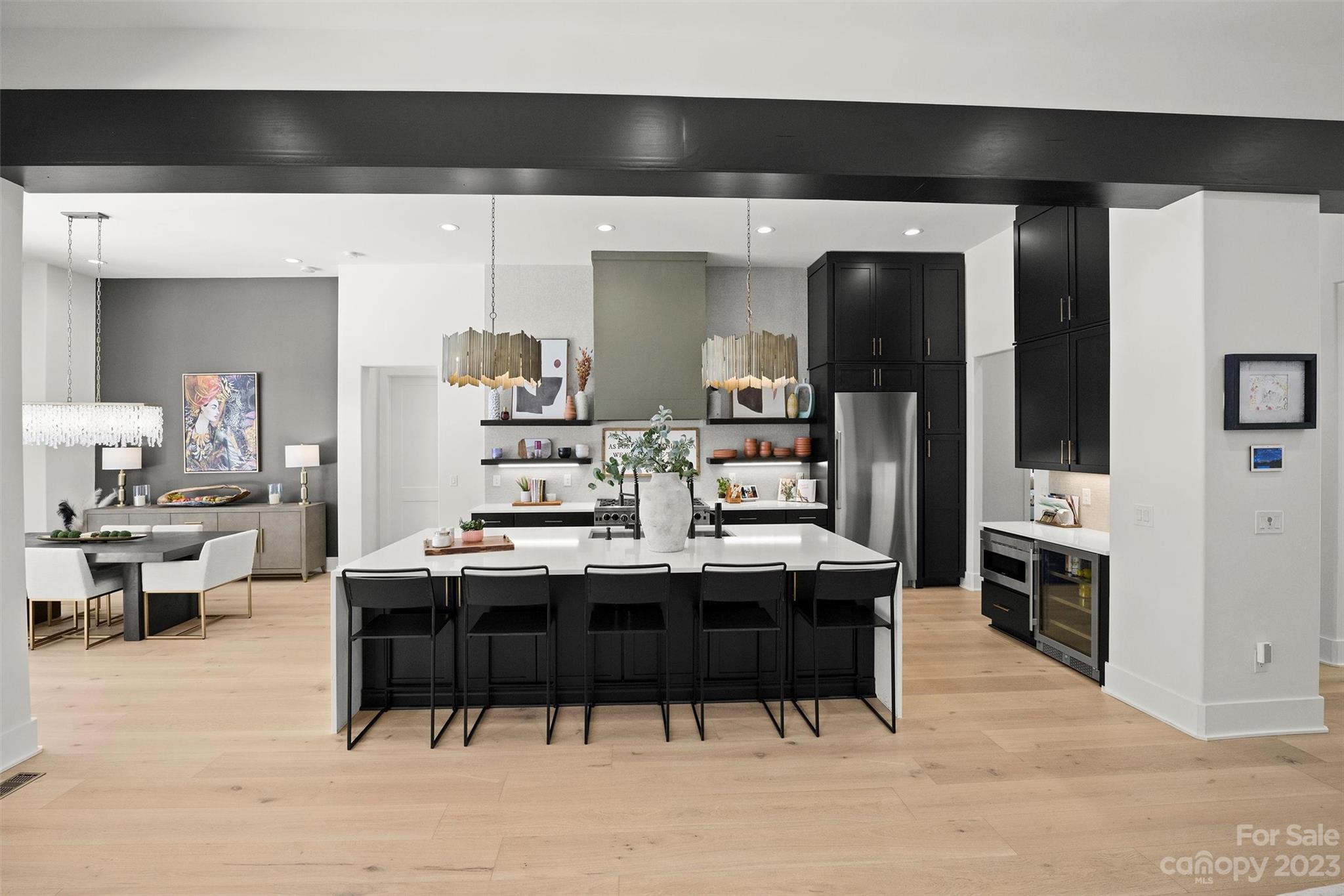 20108 Schooner Drive Cornelius, NC 28031 - Photo 4 of 46 a kitchen with stainless steel appliances kitchen island granite countertop a table and chairs in it