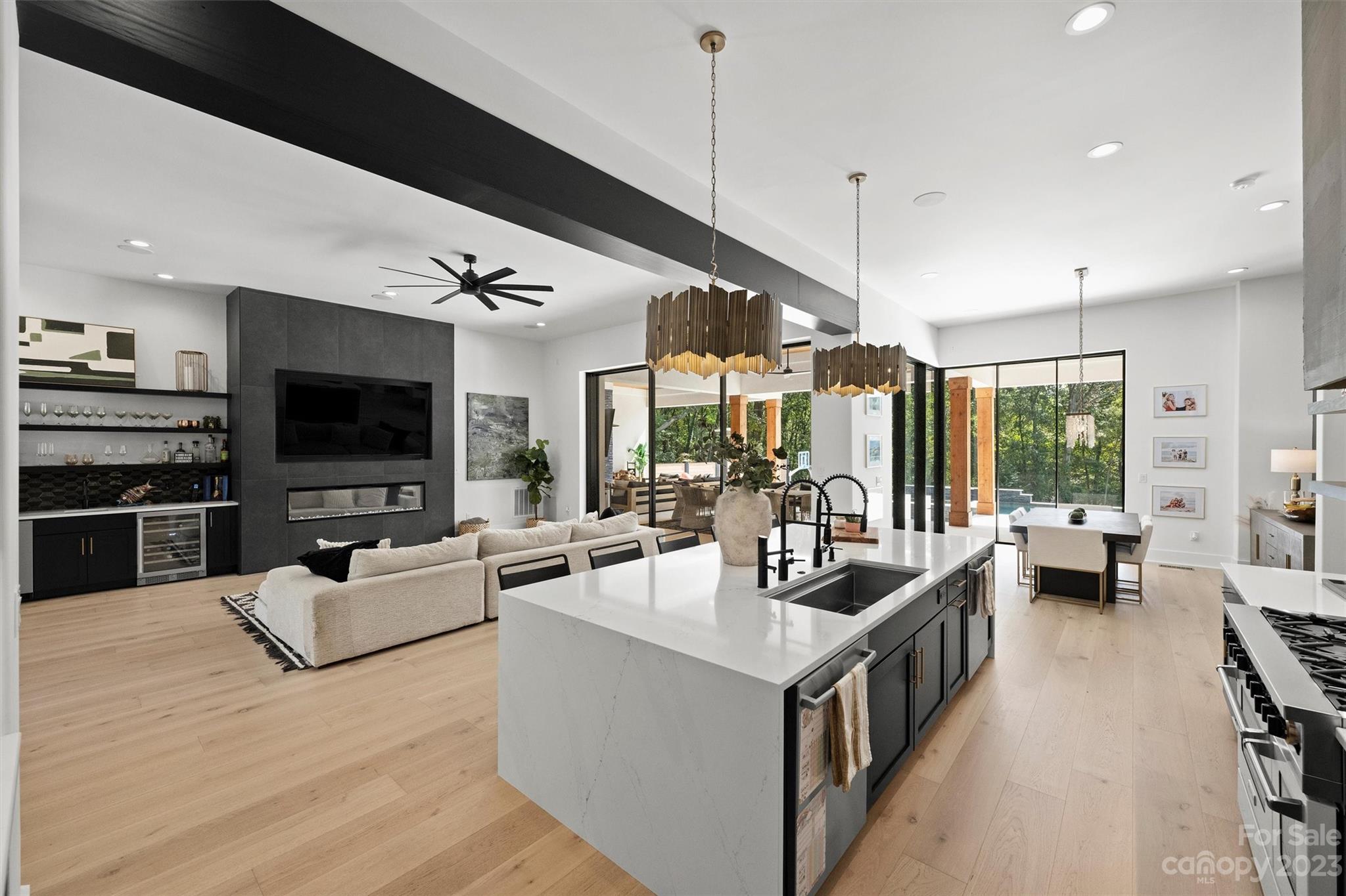 20108 Schooner Drive Cornelius, NC 28031 - Photo 6 of 46 a living room with furniture large flat screen tv and a large window