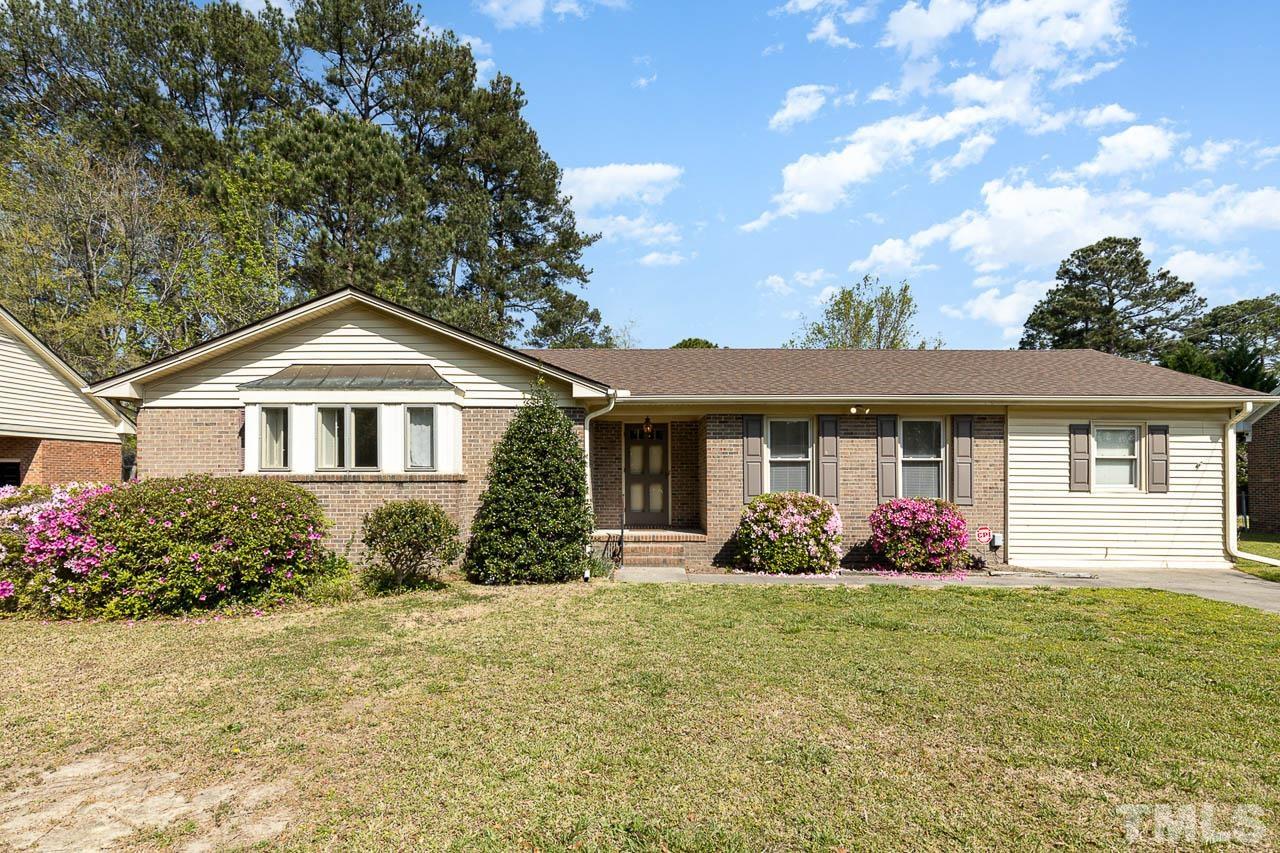 200 Ridge Road Northwest Wilson, NC 27896 - Photo 1 of 25 a front view of house with yard and trees around