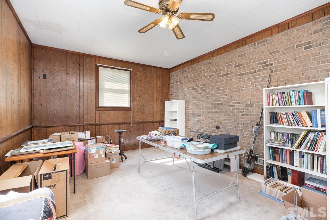 200 Ridge Road Northwest Wilson, NC 27896 - Photo 12 of 25 a reading room with furniture and book shelf