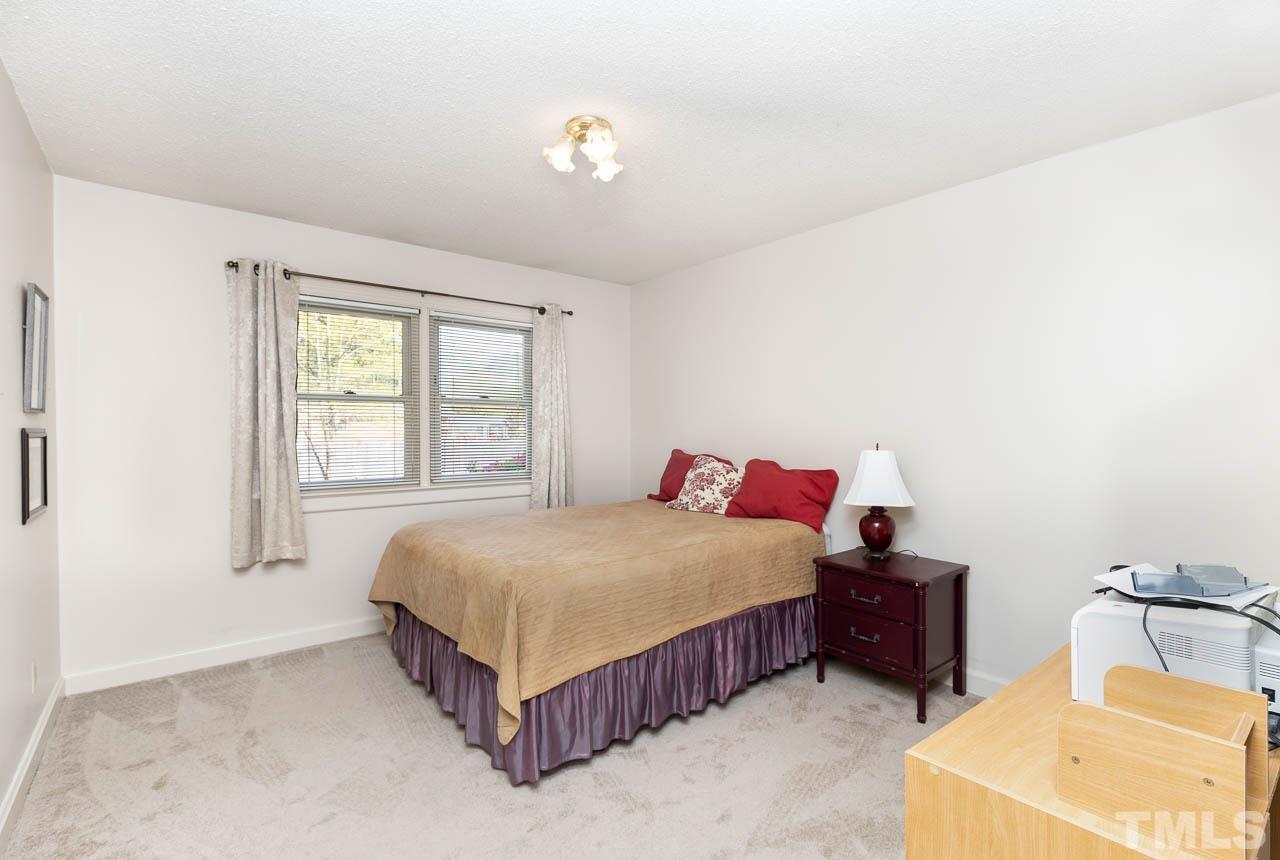 200 Ridge Road Northwest Wilson, NC 27896 - Photo 14 of 25 a bedroom with a bed and window