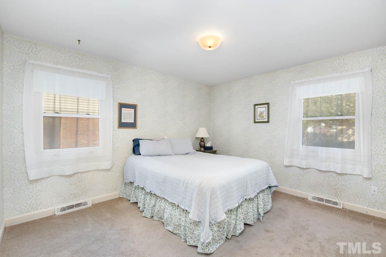 200 Ridge Road Northwest Wilson, NC 27896 - Photo 15 of 25 a bedroom with a bed and window