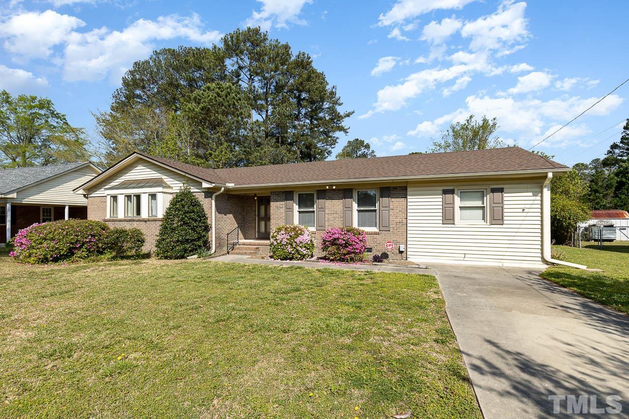 200 Ridge Road Northwest Wilson, NC 27896 - Photo 2 of 25 a front view of house with yard and trees around