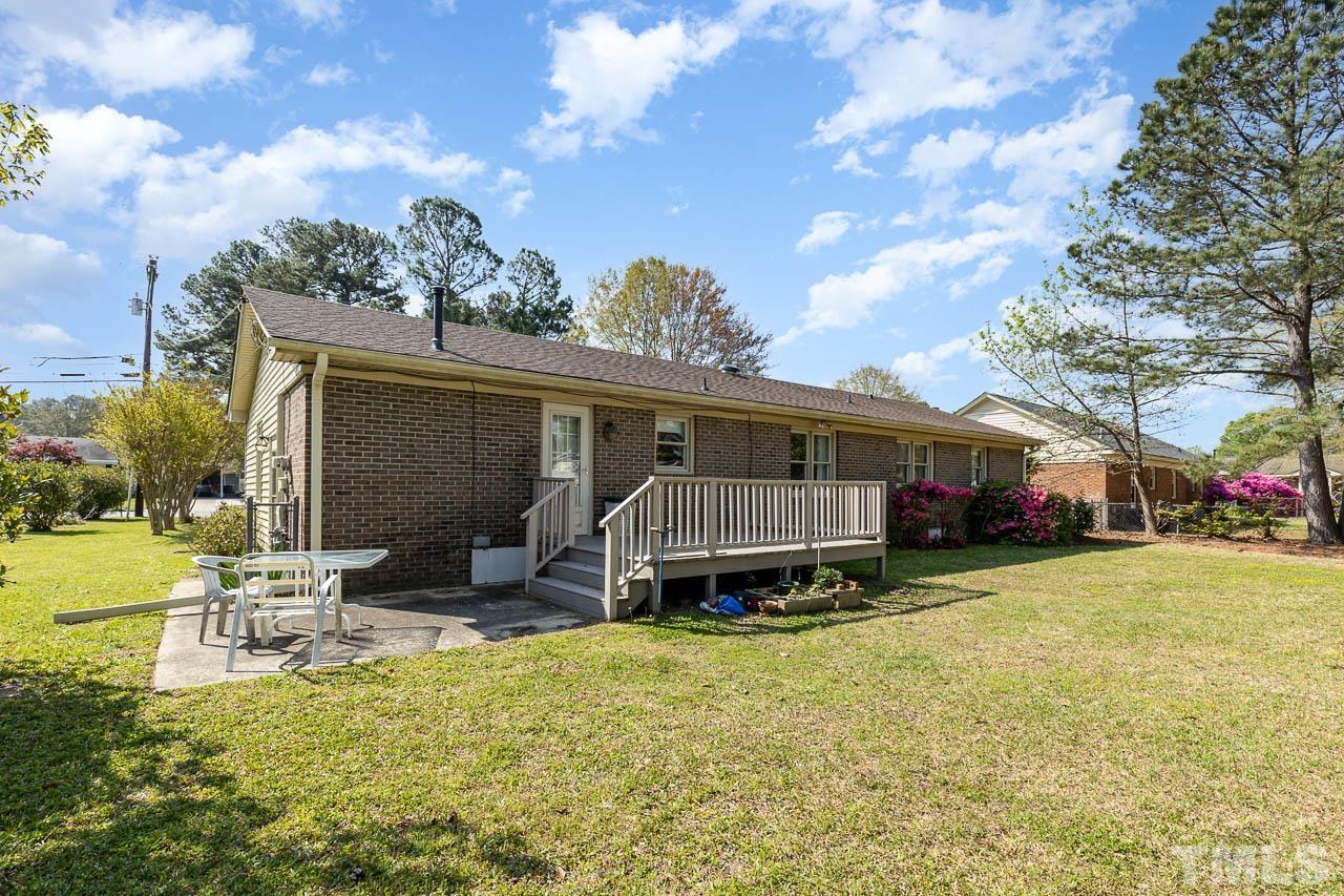 200 Ridge Road Northwest Wilson, NC 27896 - Photo 21 of 25 a view of a house with a big yard and large trees
