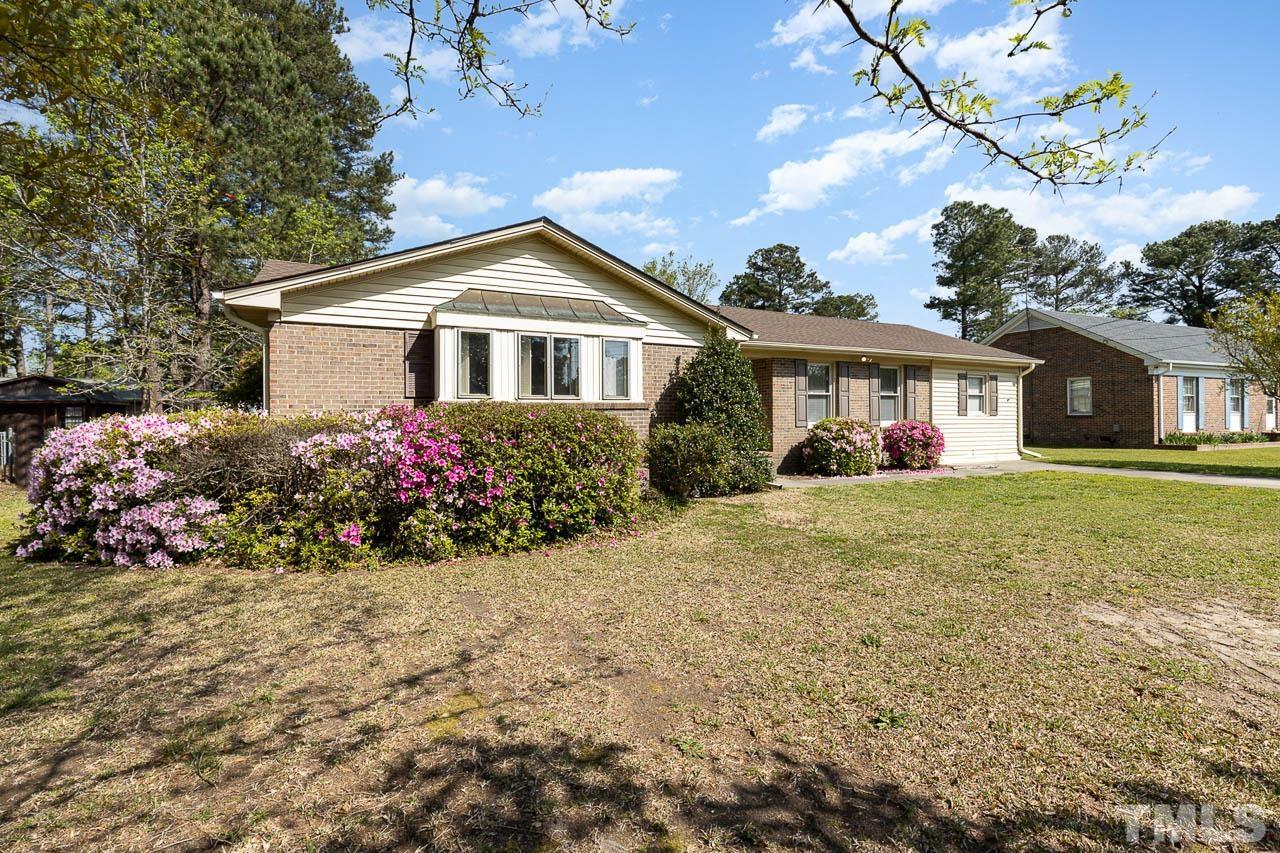 200 Ridge Road Northwest Wilson, NC 27896 - Photo 4 of 25 a front view of house with yard and trees around