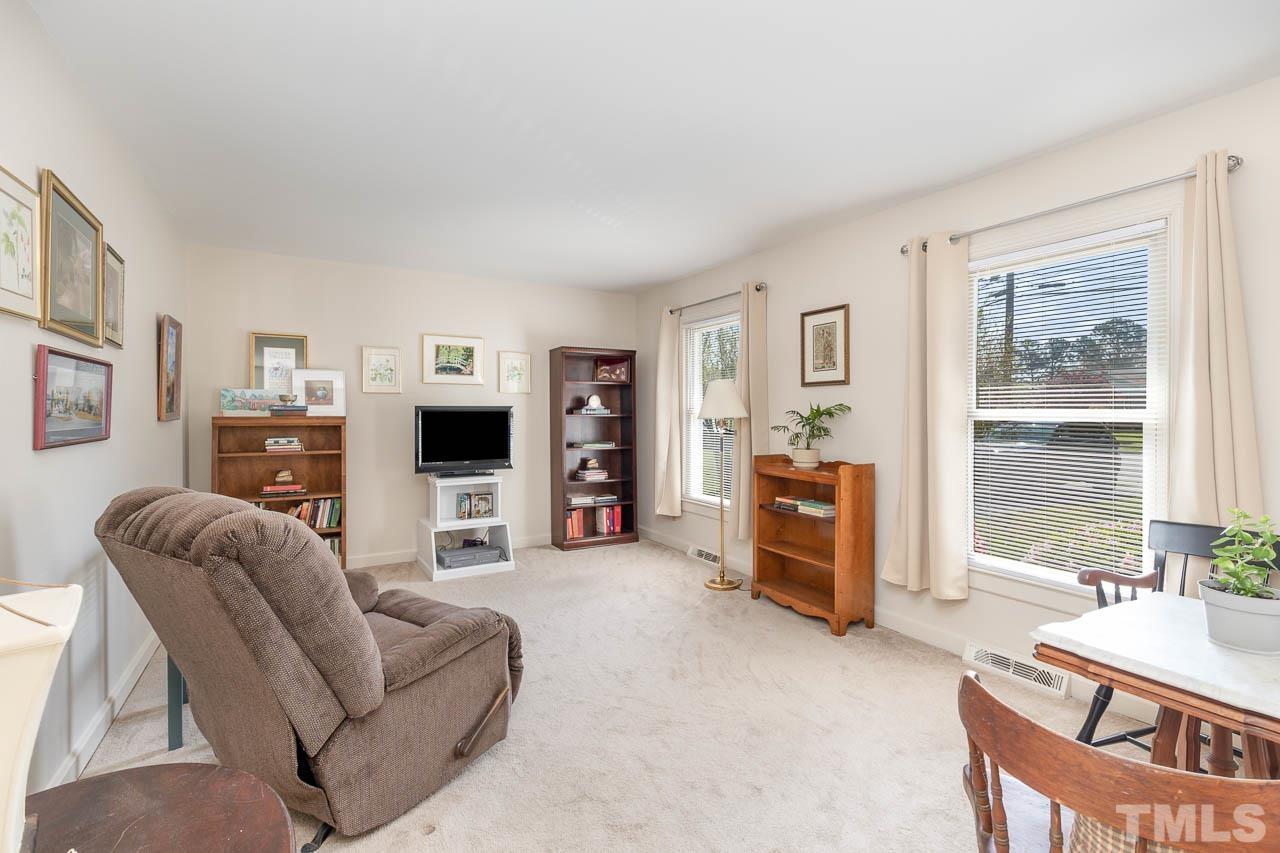 200 Ridge Road Northwest Wilson, NC 27896 - Photo 6 of 25 a living room with furniture and a flat screen tv