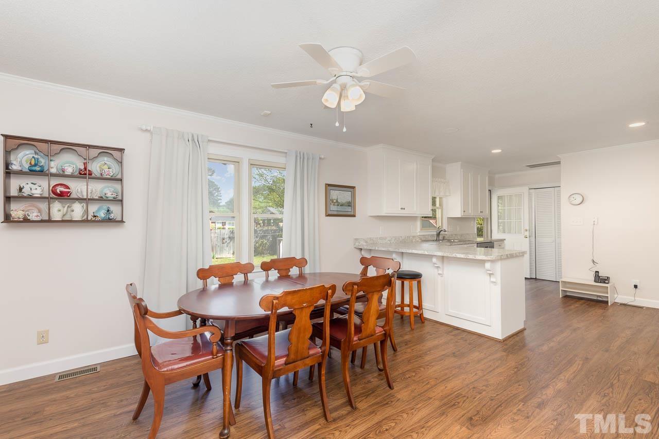 200 Ridge Road Northwest Wilson, NC 27896 - Photo 7 of 25 a view of a dining room with furniture window and wooden floor