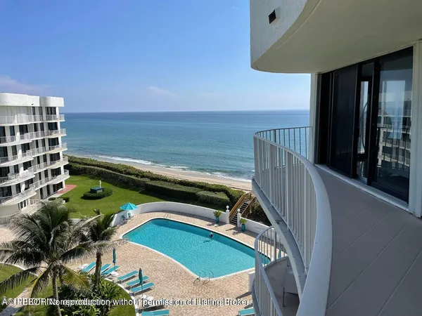 a view of a balcony with ocean view