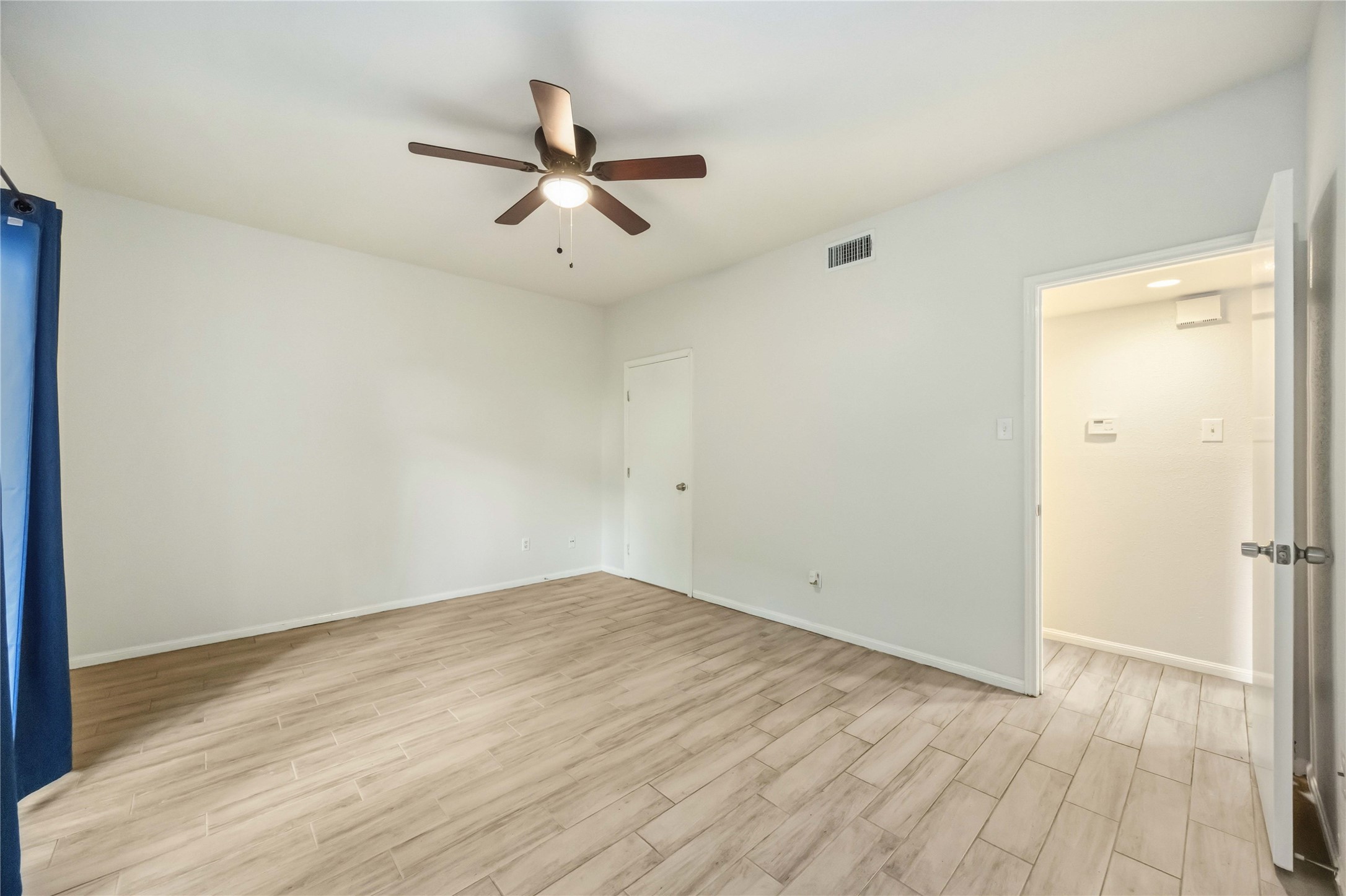 2100 Tanglewilde Street, Unit 531 Houston, TX 77063 - Photo 11 of 25 wooden floor in an empty room
