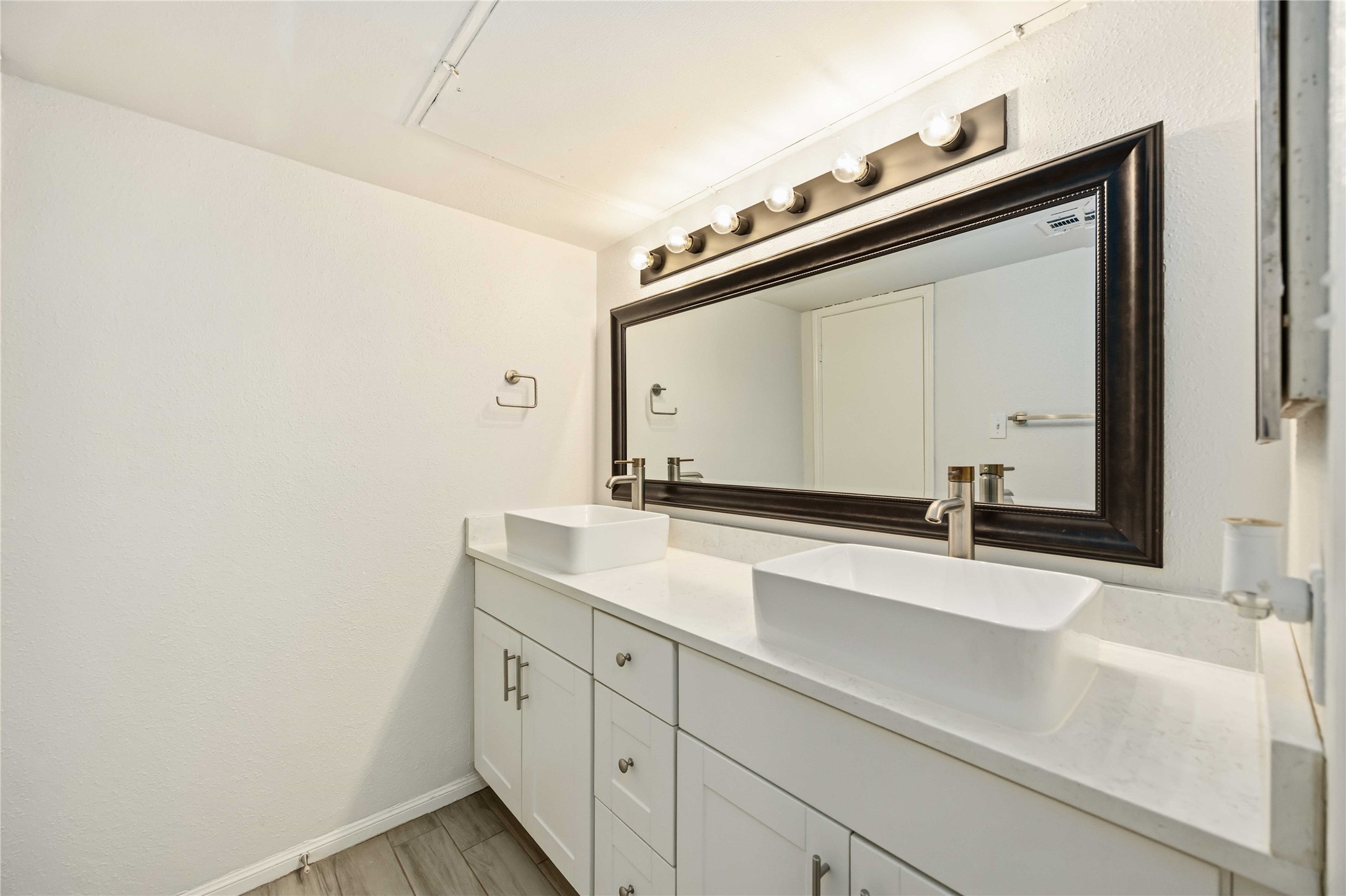 2100 Tanglewilde Street, Unit 531 Houston, TX 77063 - Photo 13 of 25 a bathroom with a sink and a mirror