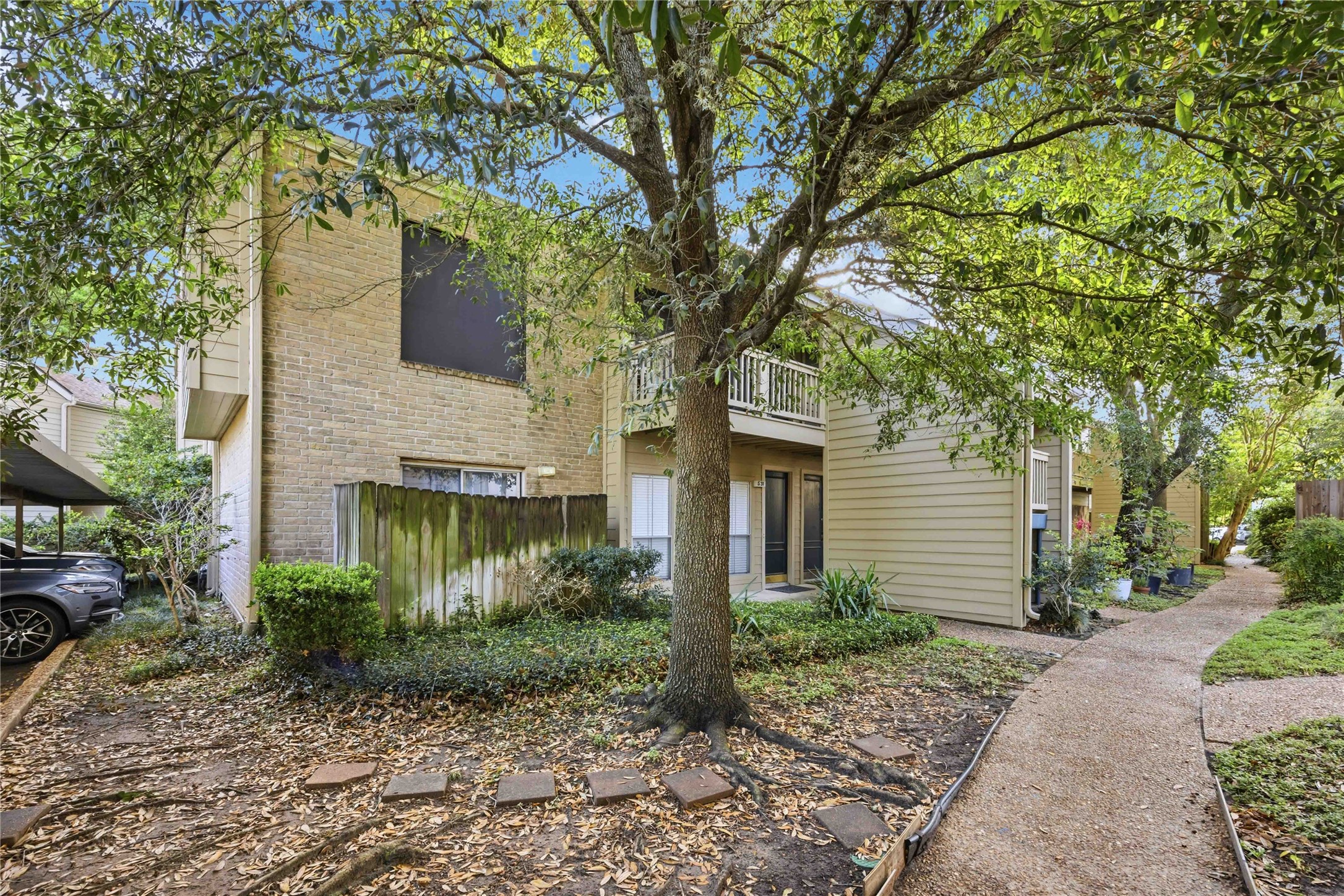 2100 Tanglewilde Street, Unit 531 Houston, TX 77063 - Photo 16 of 25 a front view of a house with garden