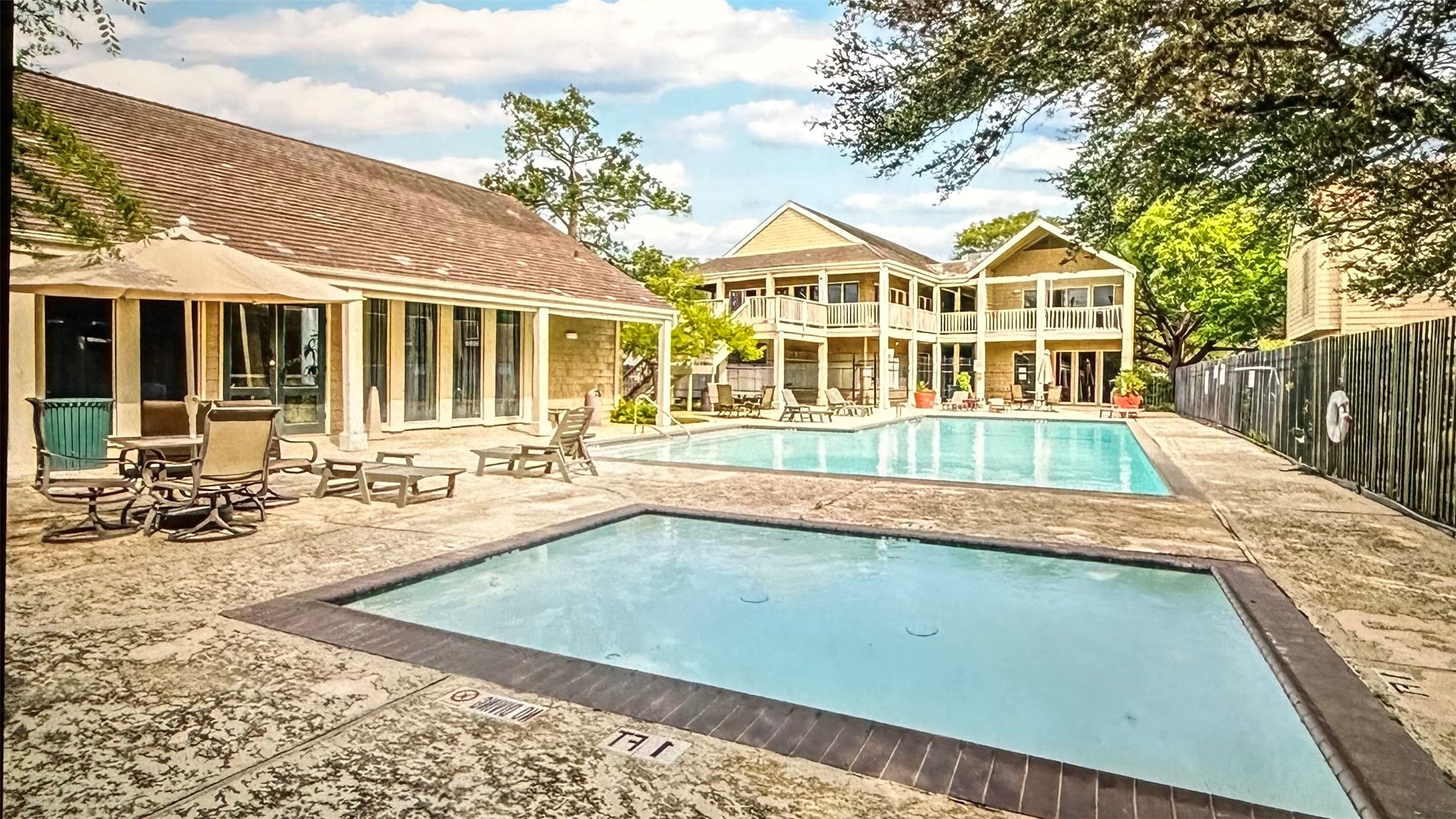 2100 Tanglewilde Street, Unit 531 Houston, TX 77063 - Photo 22 of 25 a view of a house with pool and sitting area