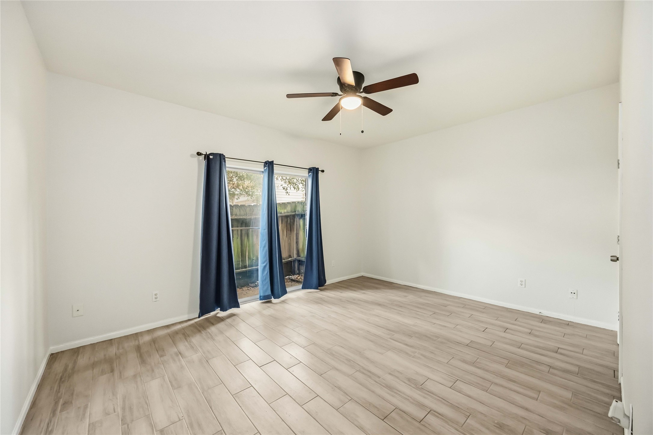 2100 Tanglewilde Street, Unit 531 Houston, TX 77063 - Photo 10 of 25 a view of empty room with wooden floor