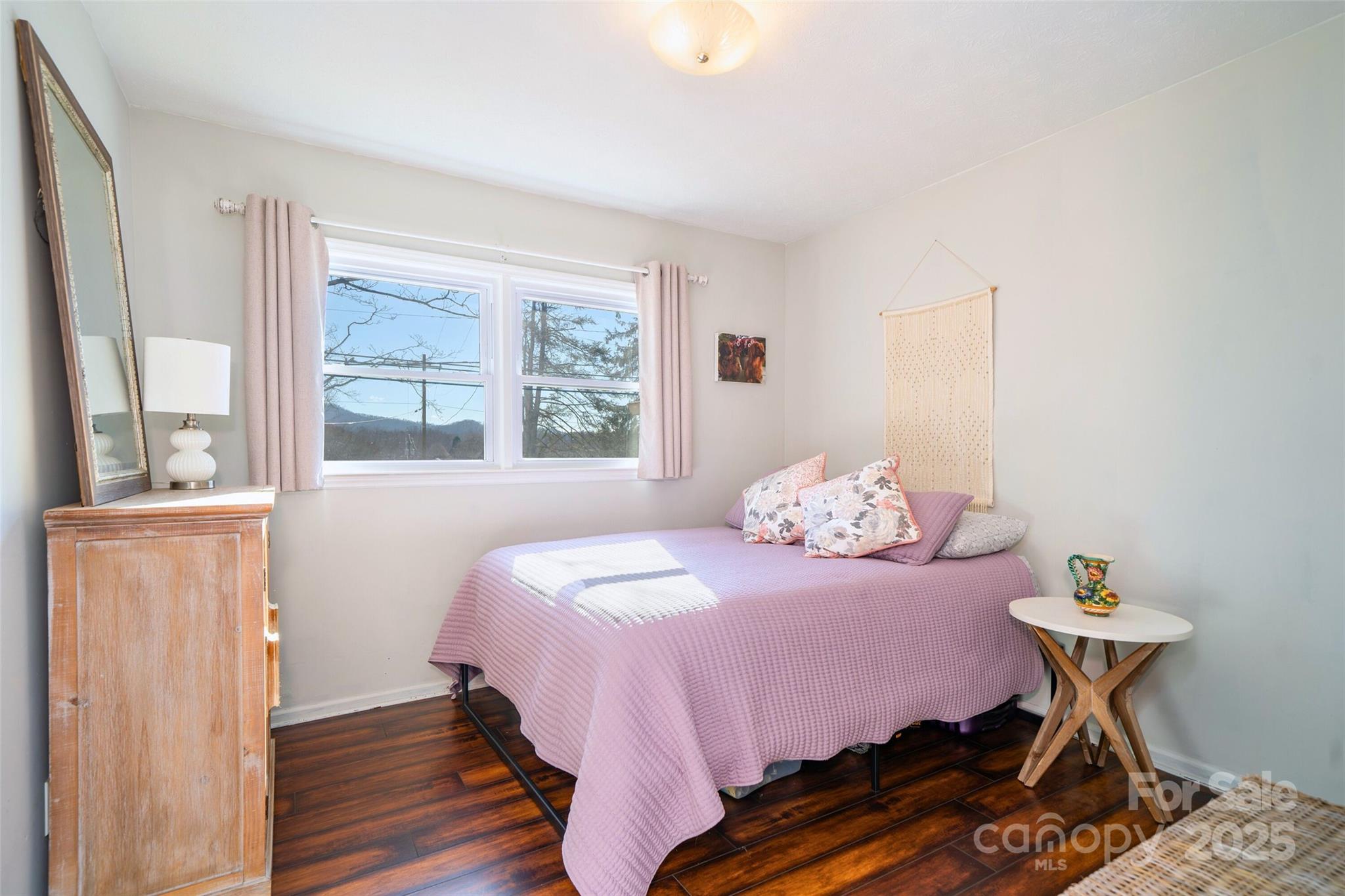 917 West Chapel Road Asheville, NC 28803 - Photo 17 of 28 a bedroom with a bed and a window