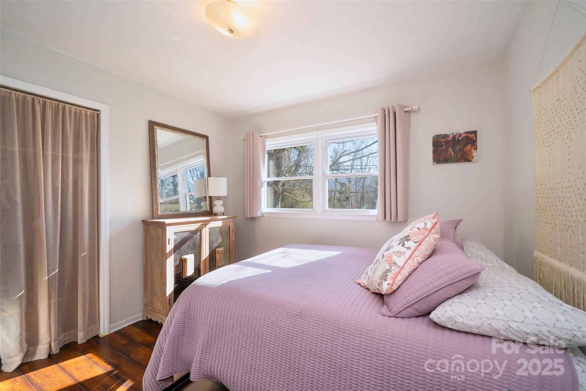 917 West Chapel Road Asheville, NC 28803 - Photo 18 of 28 a bedroom with a bed and a window