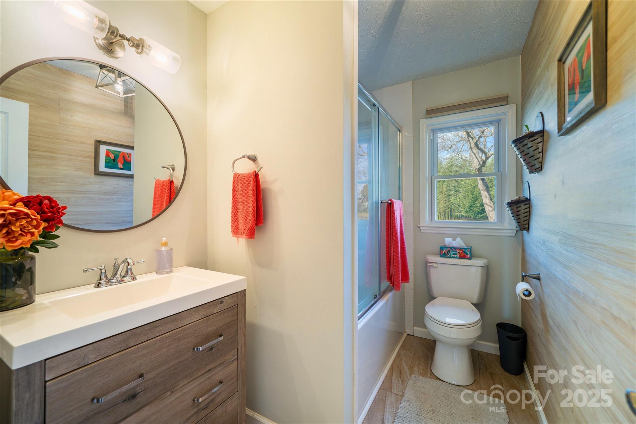 917 West Chapel Road Asheville, NC 28803 - Photo 19 of 28 a bathroom with a sink vanity mirror and toilet