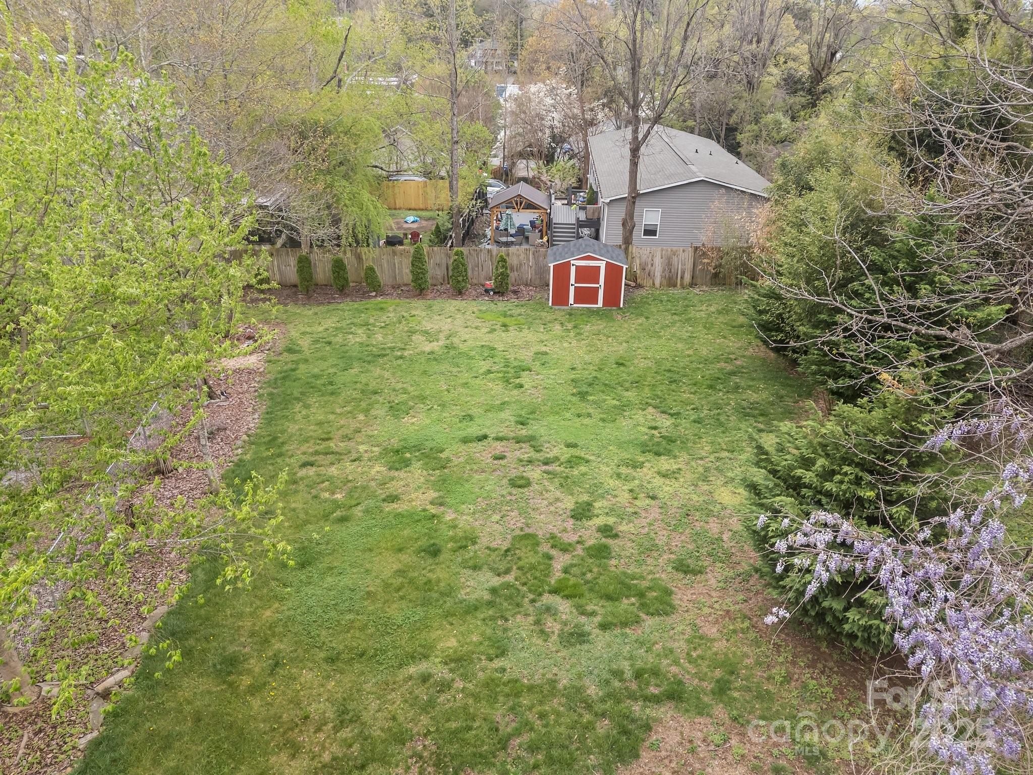 917 West Chapel Road Asheville, NC 28803 - Photo 25 of 28 a view of a wooden house with a yard