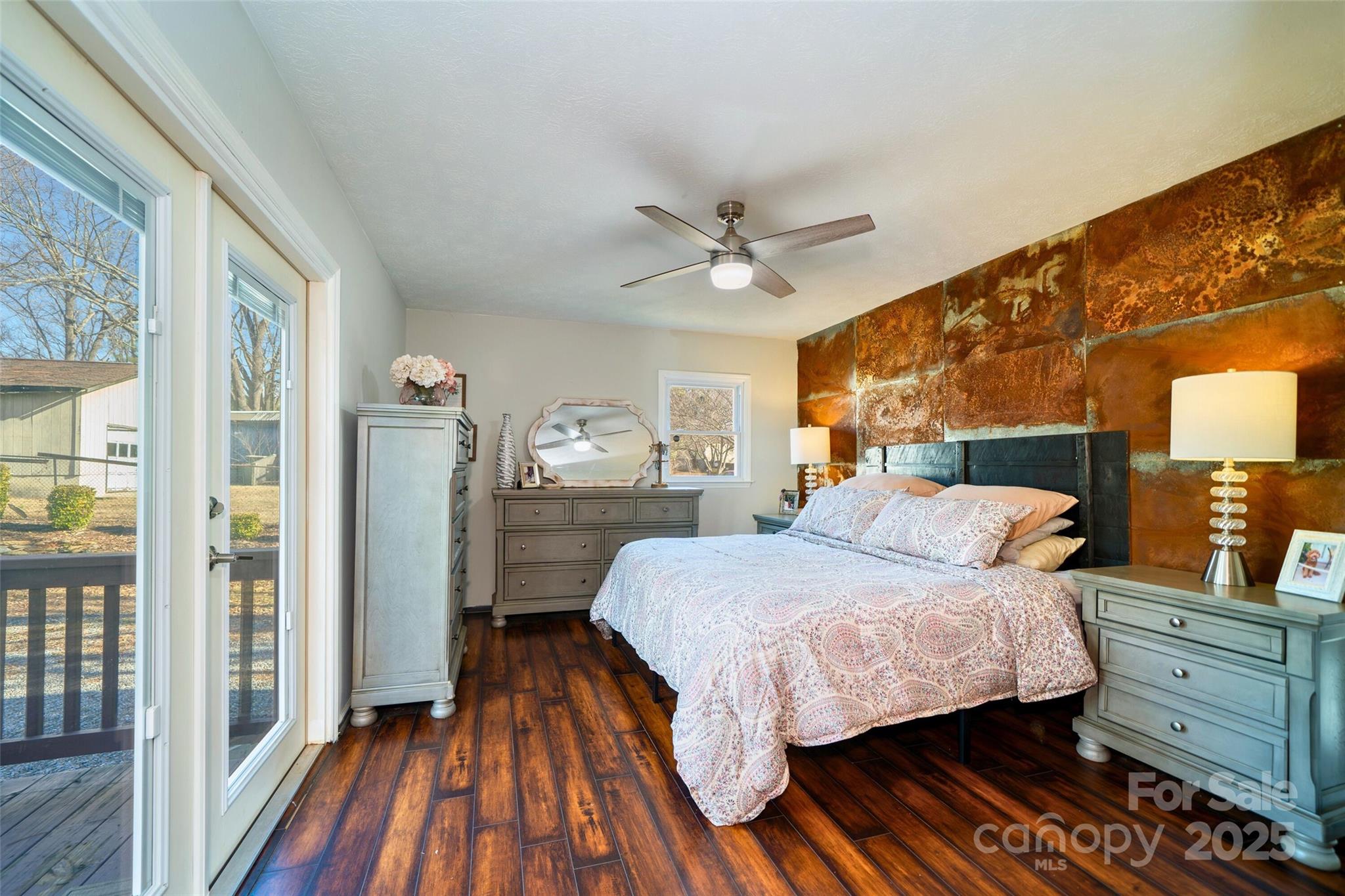 917 West Chapel Road Asheville, NC 28803 - Photo 4 of 28 a bedroom with a bed and wooden floor
