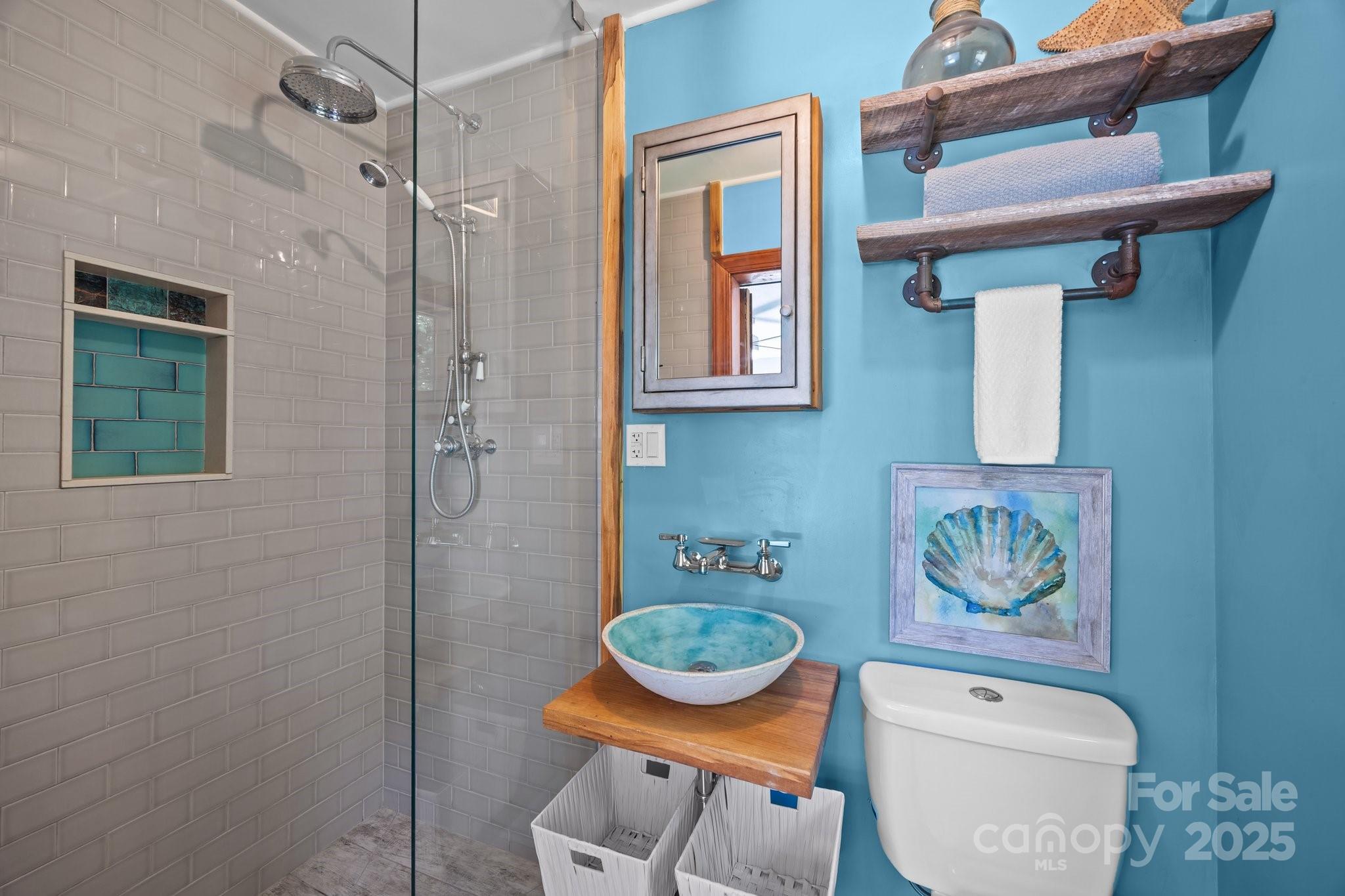 917 West Chapel Road Asheville, NC 28803 - Photo 5 of 28 a bathroom with a toilet a sink and a shower