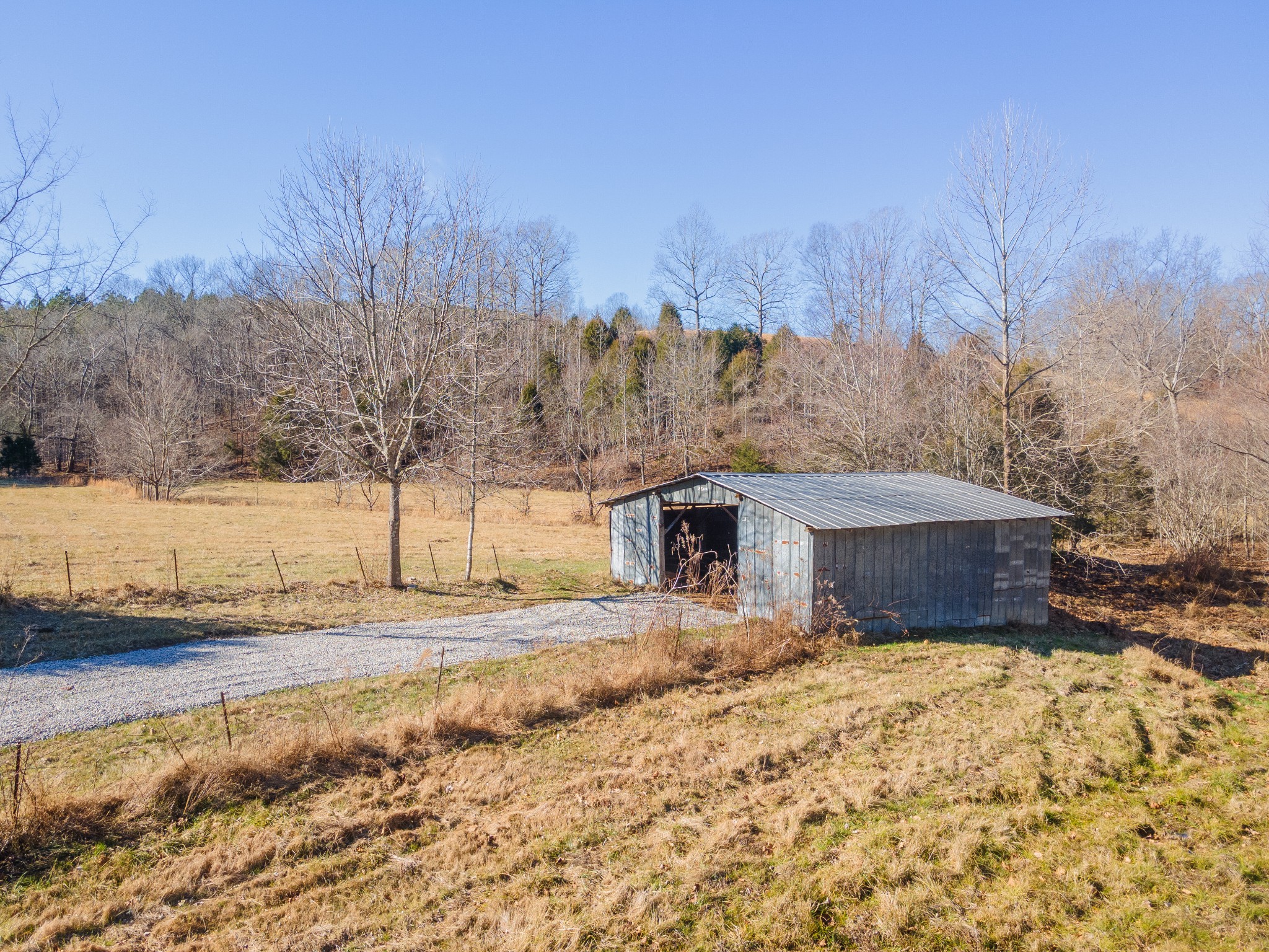 5120 Brison Road Collinwood, TN 38450 - Photo 1 of 25 a view of a house with a yard covered in snow