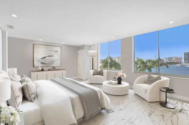 a bedroom with furniture a bed and a large window