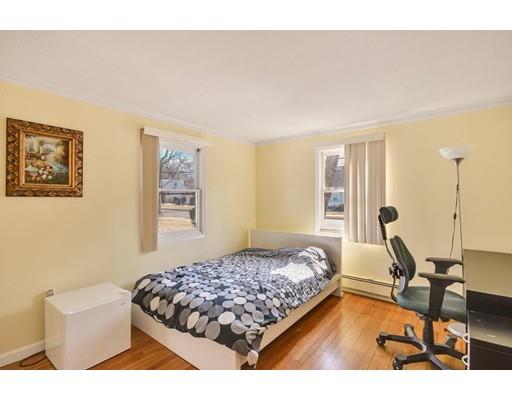25 Truman Road Newton, MA 02459 - Photo 11 of 19 a bedroom with a bed window and couch