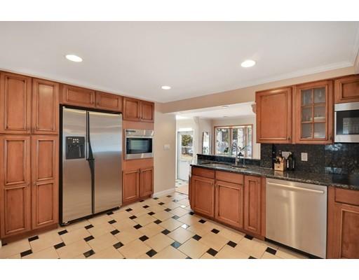 25 Truman Road Newton, MA 02459 - Photo 6 of 19 a kitchen with stainless steel appliances a refrigerator and a sink