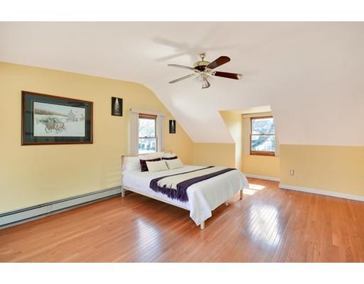 25 Truman Road Newton, MA 02459 - Photo 9 of 19 a living room with a bed furniture and a wooden floor