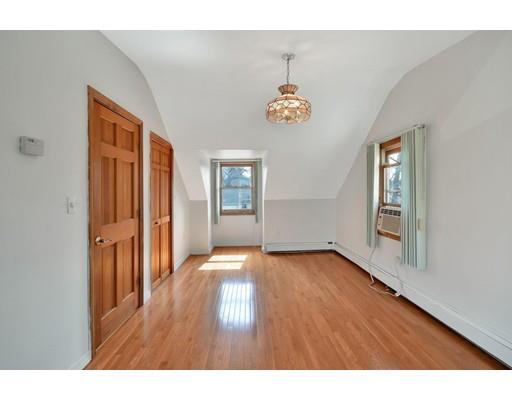 25 Truman Road Newton, MA 02459 - Photo 10 of 19 a view of empty room with wooden floor and window