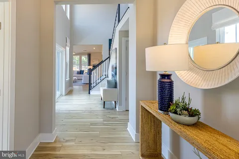 a view of hall way with furniture