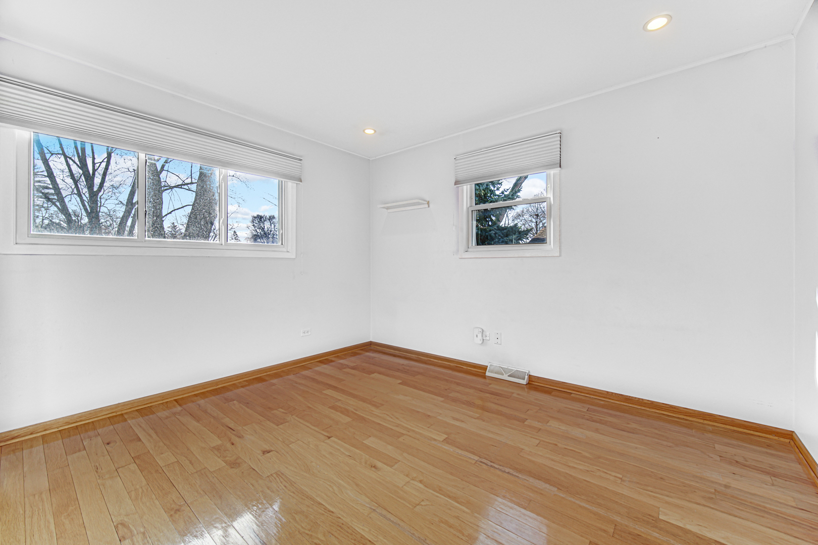 2109 Robin Lane Rolling Meadows, IL 60008 - Photo 16 of 21 a view of an empty room with wooden floor and a window