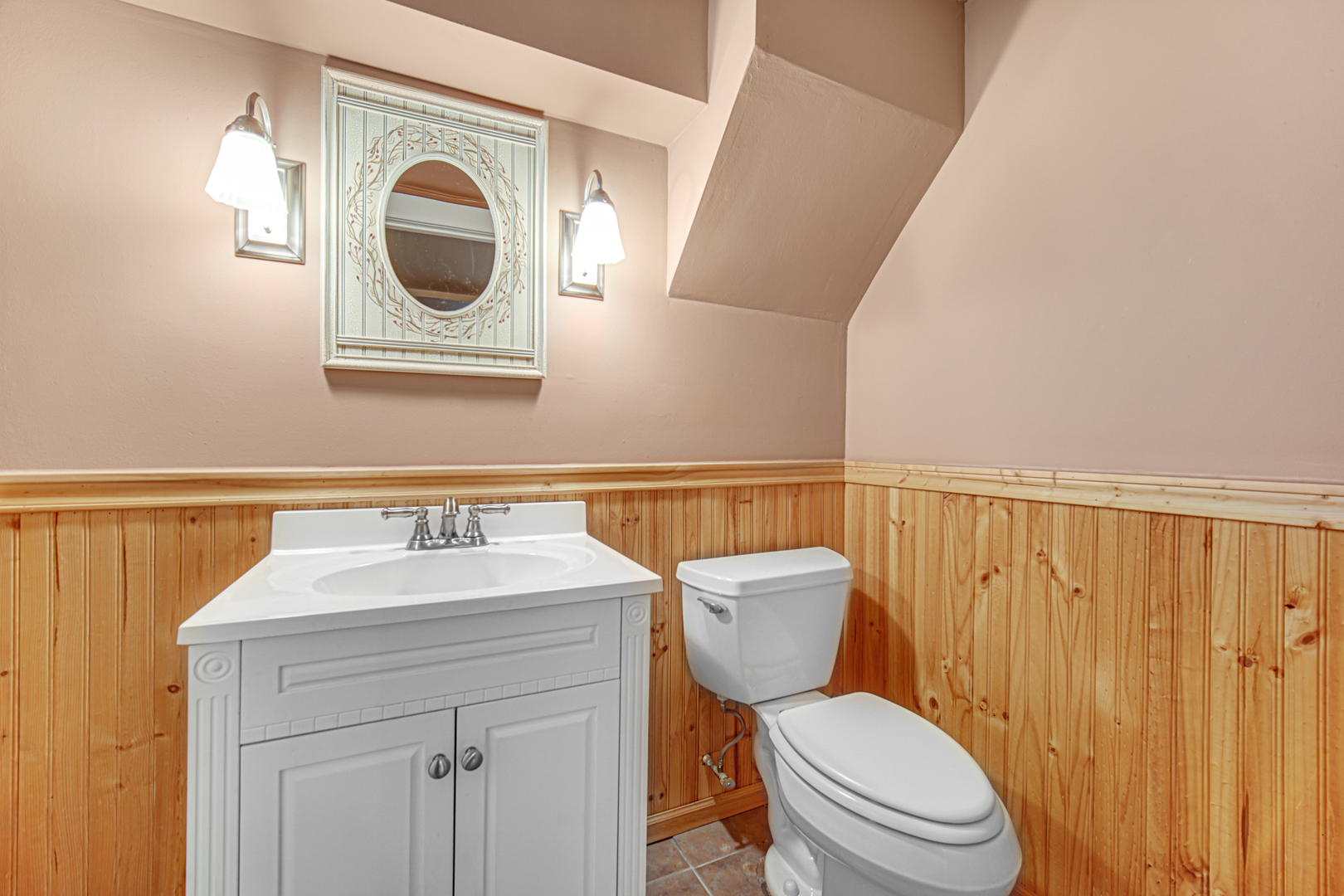 2109 Robin Lane Rolling Meadows, IL 60008 - Photo 18 of 21 a bathroom with a toilet a sink and a mirror