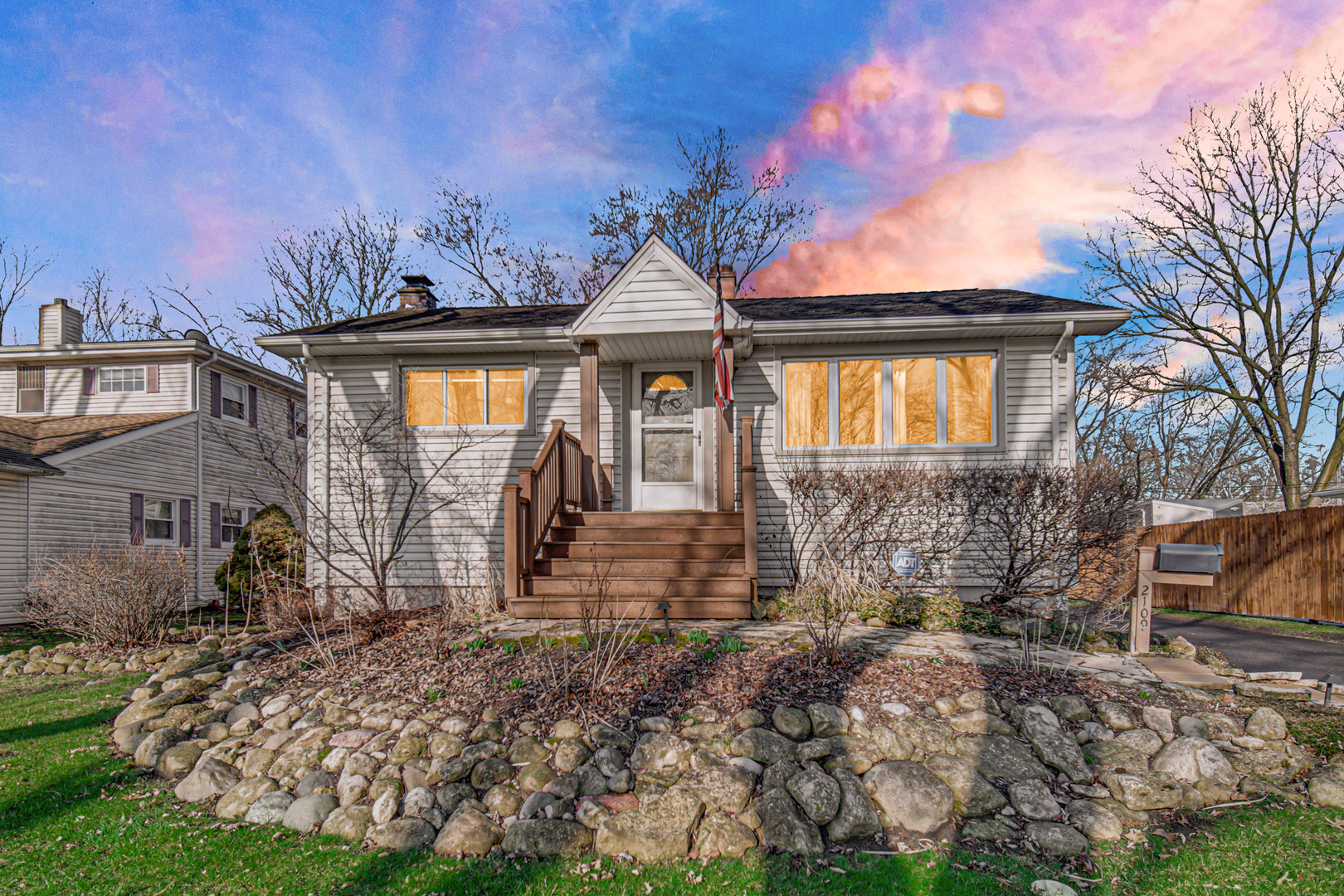 2109 Robin Lane Rolling Meadows, IL 60008 - Photo 2 of 21 a front view of a house with garden